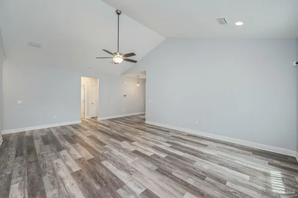 a view of a room with a sink and a ceiling fan