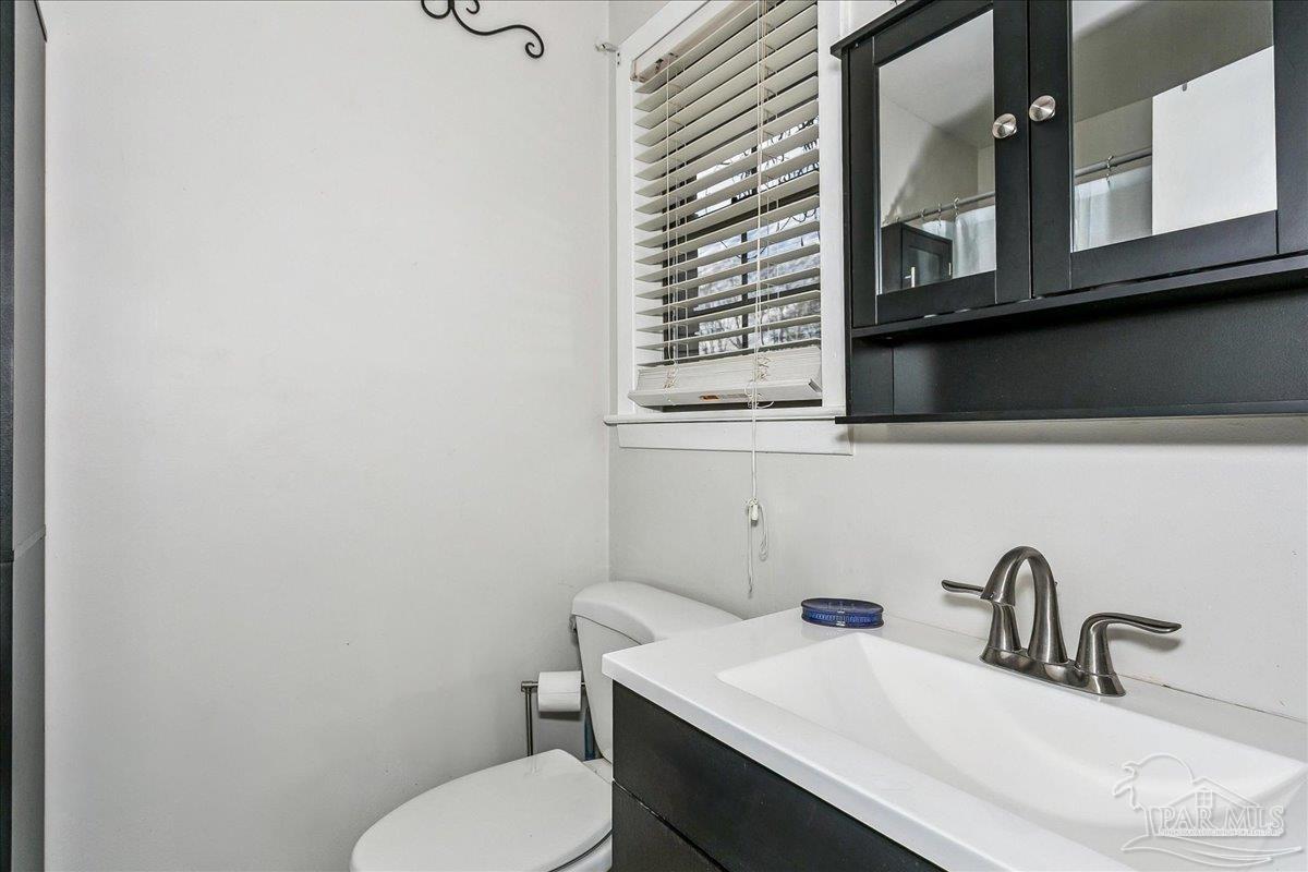 295 Columbus Circle Brewton, AL 36426 - Photo 17 of 32 a bathroom with a sink and a toilet