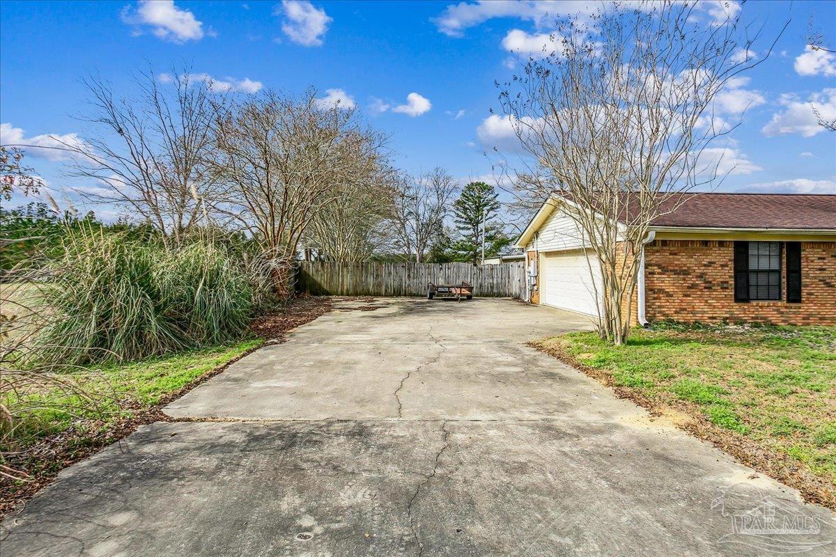 295 Columbus Circle Brewton, AL 36426 - Photo 2 of 32 a view of a house with a yard