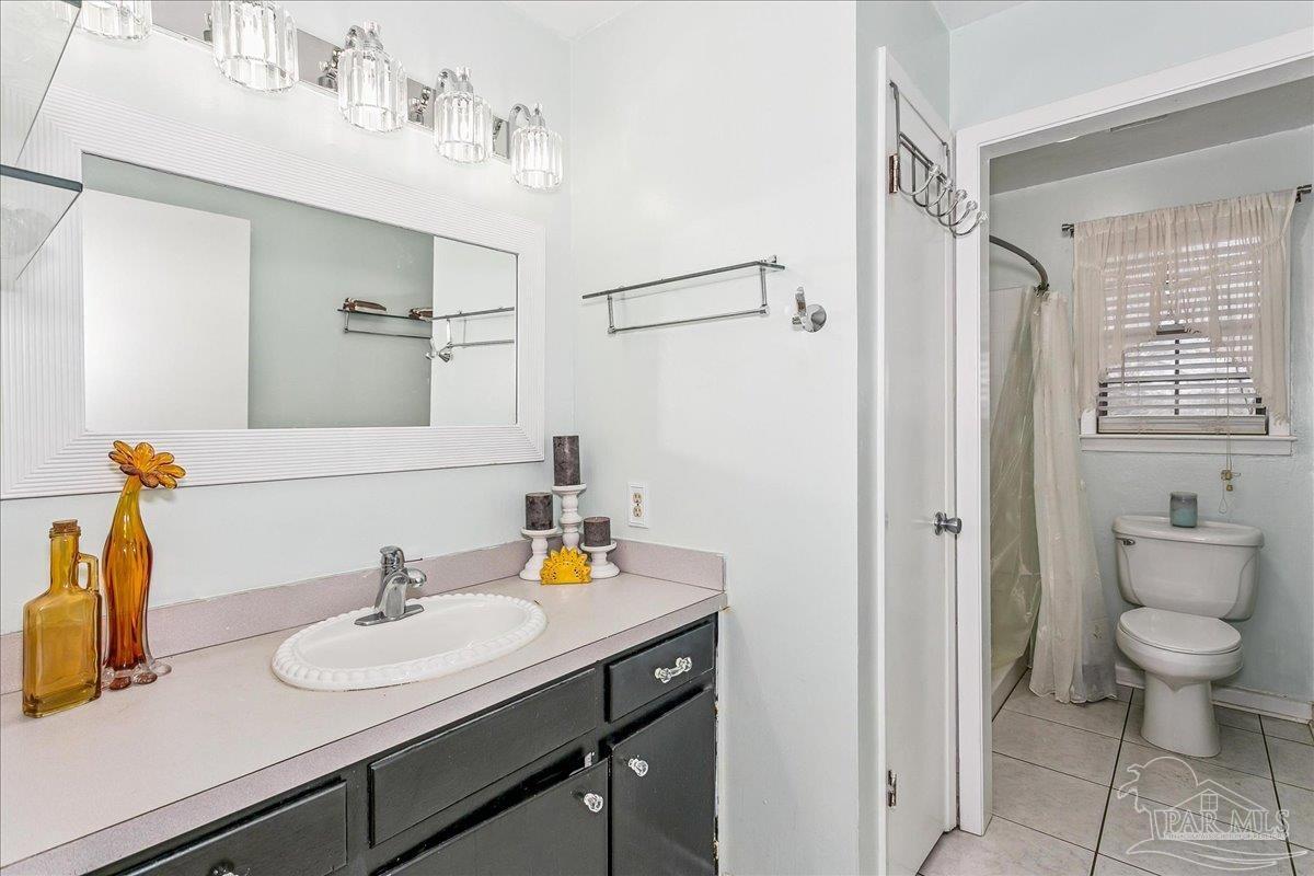 295 Columbus Circle Brewton, AL 36426 - Photo 22 of 32 a bathroom with a sink toilet and shower