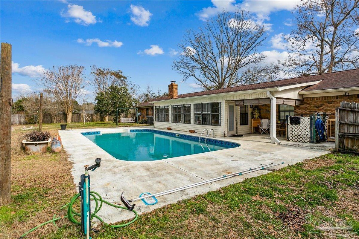 295 Columbus Circle Brewton, AL 36426 - Photo 27 of 32 a view of a house with pool and chairs