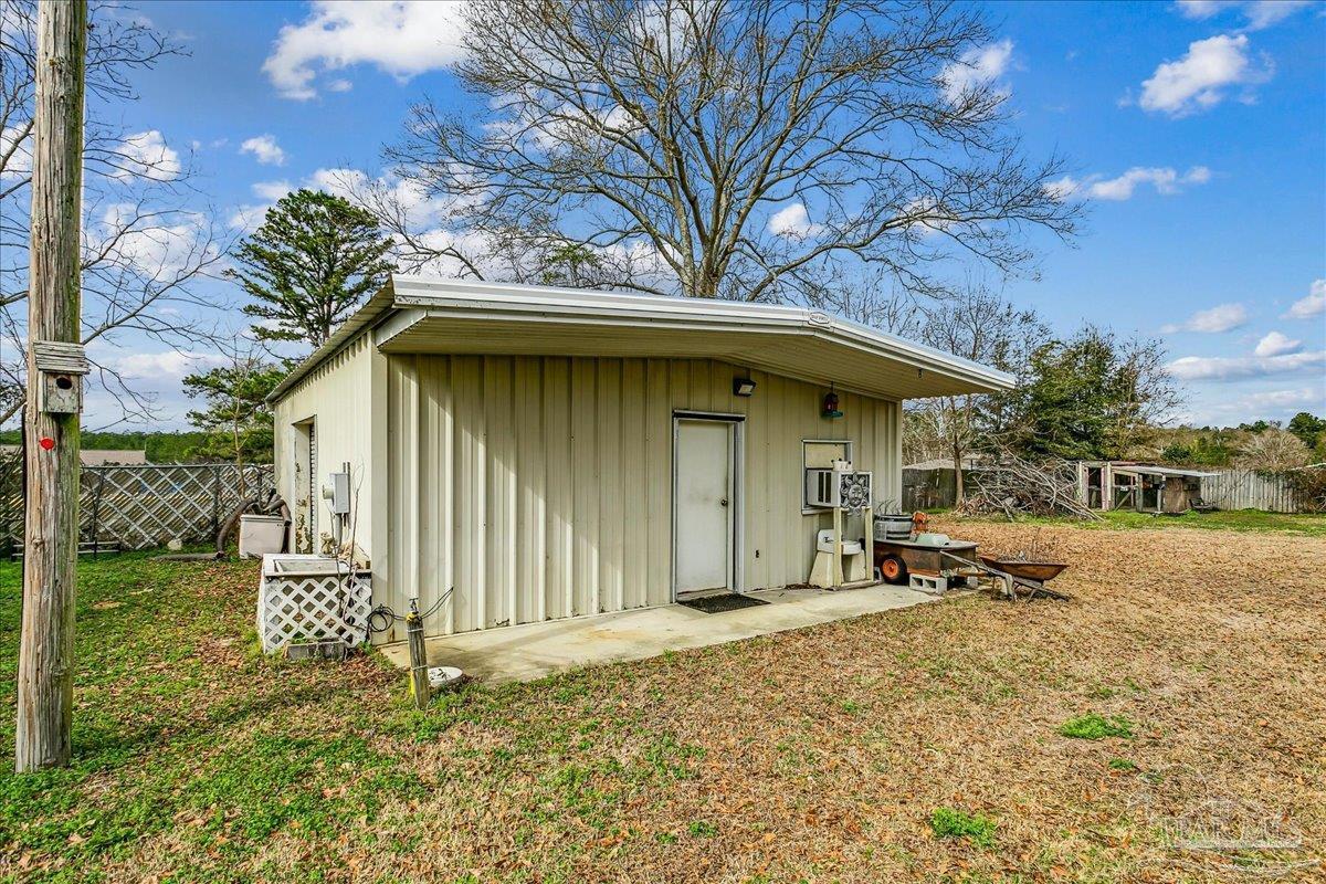 295 Columbus Circle Brewton, AL 36426 - Photo 30 of 32 a front view of a house with a yard