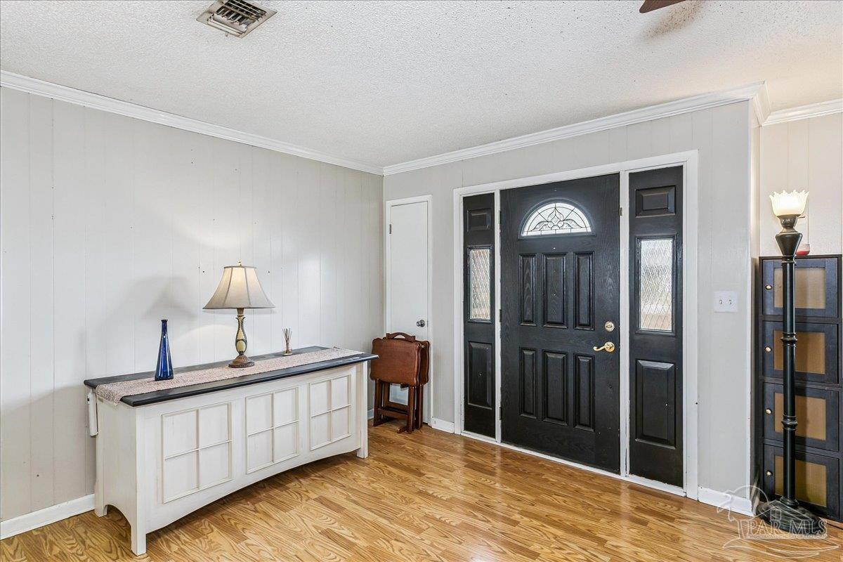 295 Columbus Circle Brewton, AL 36426 - Photo 5 of 32 a bedroom with a bed and a mirror