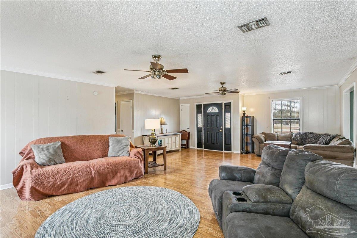 295 Columbus Circle Brewton, AL 36426 - Photo 8 of 32 a living room with furniture and wooden floor