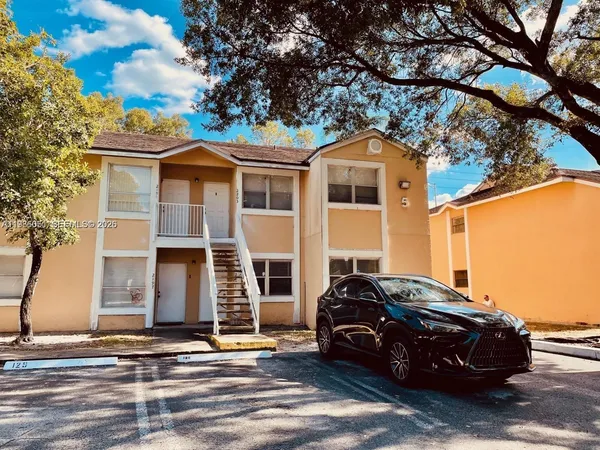 a car parked in front of a house