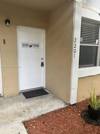 a view of a backyard of the house