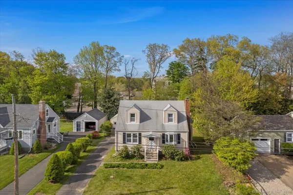aerial view of a house with a yard