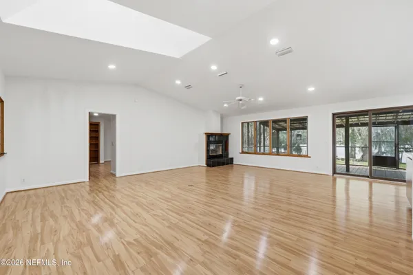 a kitchen with stainless steel appliances kitchen island granite countertop a refrigerator and a sink