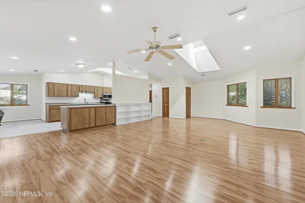 a view of a livingroom with furniture and windows
