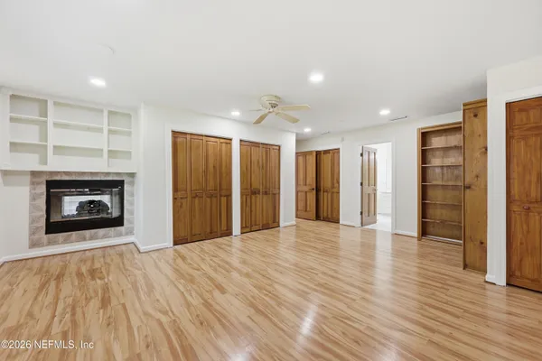 a view of livingroom with hardwood floor and a ceiling fan
