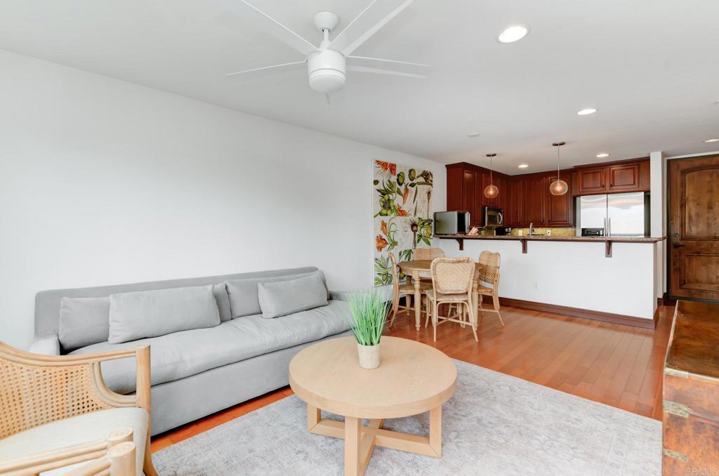 935 Genter Street, Unit 212 La Jolla, CA 92037 - Photo 7 of 23 a living room with furniture and kitchen view