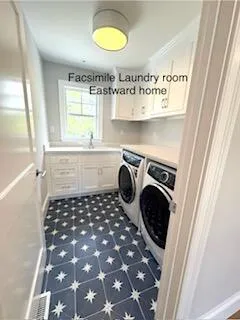 a kitchen with a sink a stove and cabinets