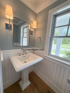 47 Daleys Terrace Orleans, MA 02653 - Photo 12 of 37 a bathroom with a sink and a mirror