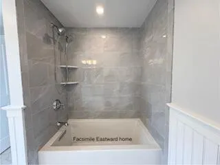 a view of a room with wooden floor and window