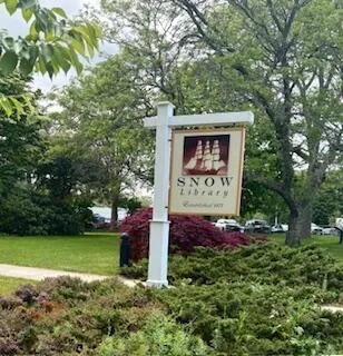 a sign that is on a brick wall