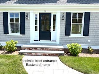 47 Daleys Terrace Orleans, MA 02653 - Photo 6 of 37 a white house with a garden in front of it