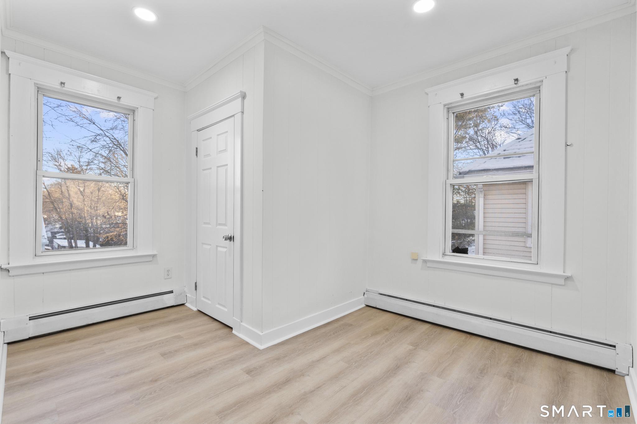 141 Augur Street Hamden, CT 06517 - Photo 13 of 25 an empty room with wooden floor and window