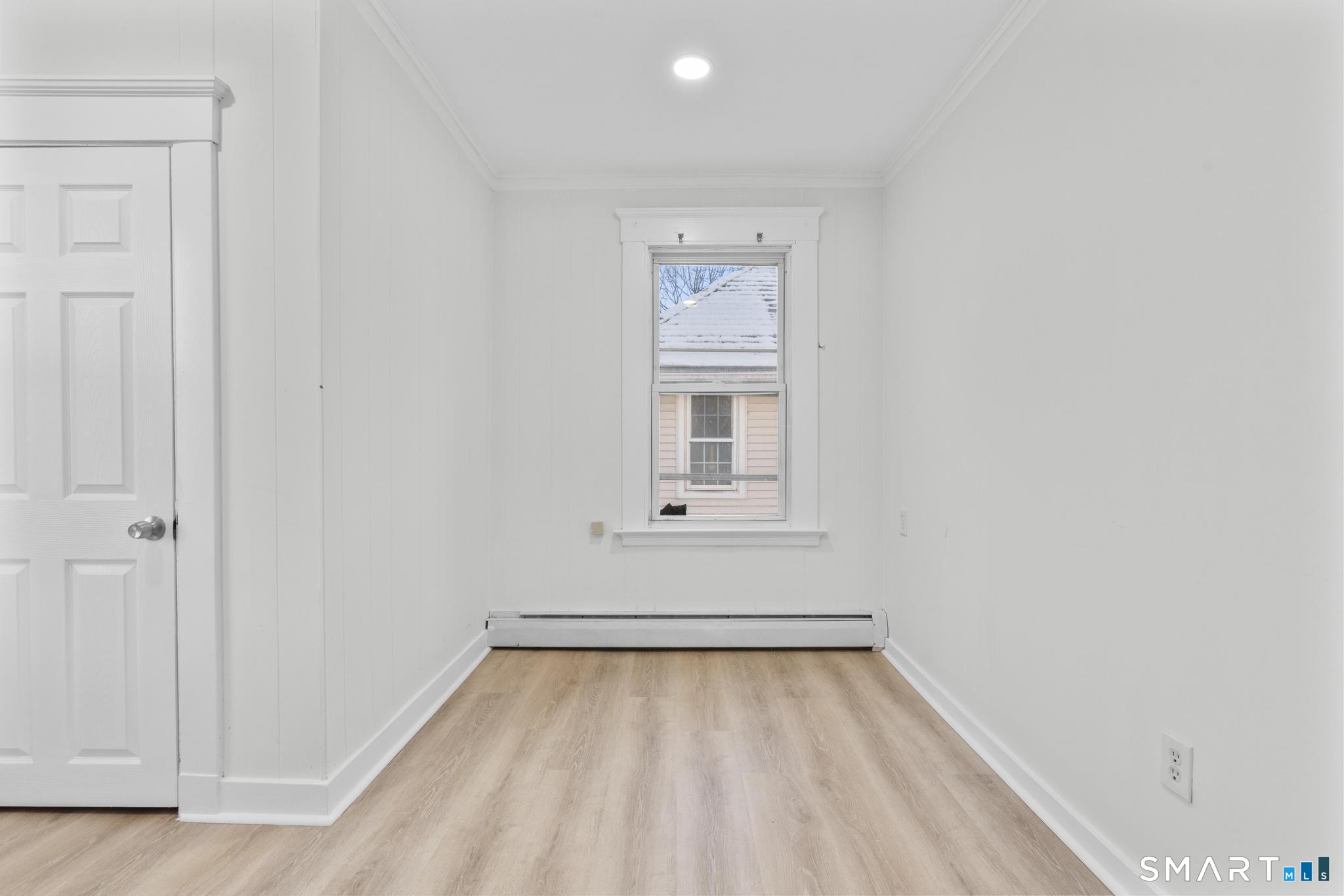 141 Augur Street Hamden, CT 06517 - Photo 15 of 25 a view of a room with wooden floor and window