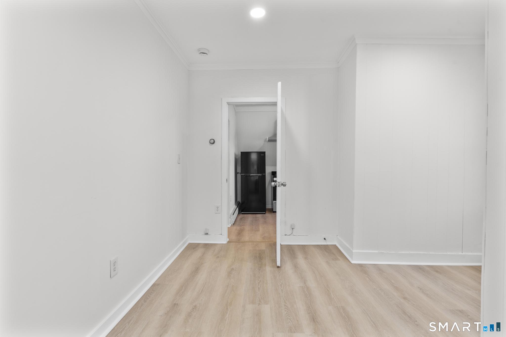 141 Augur Street Hamden, CT 06517 - Photo 16 of 25 a view of a room with wooden floor and entrance