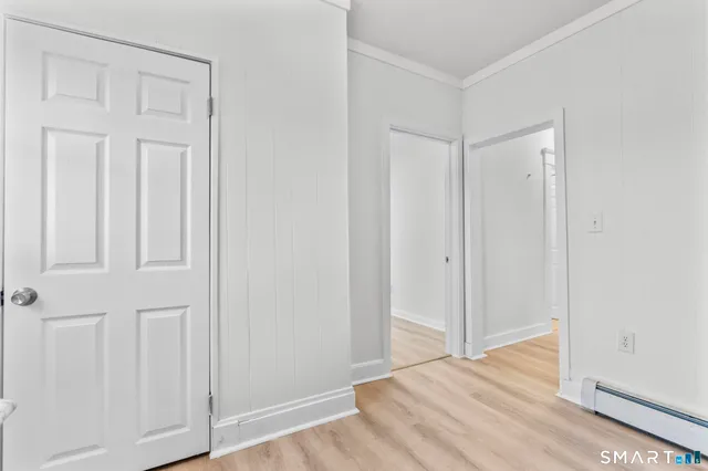 an empty room with wooden floor