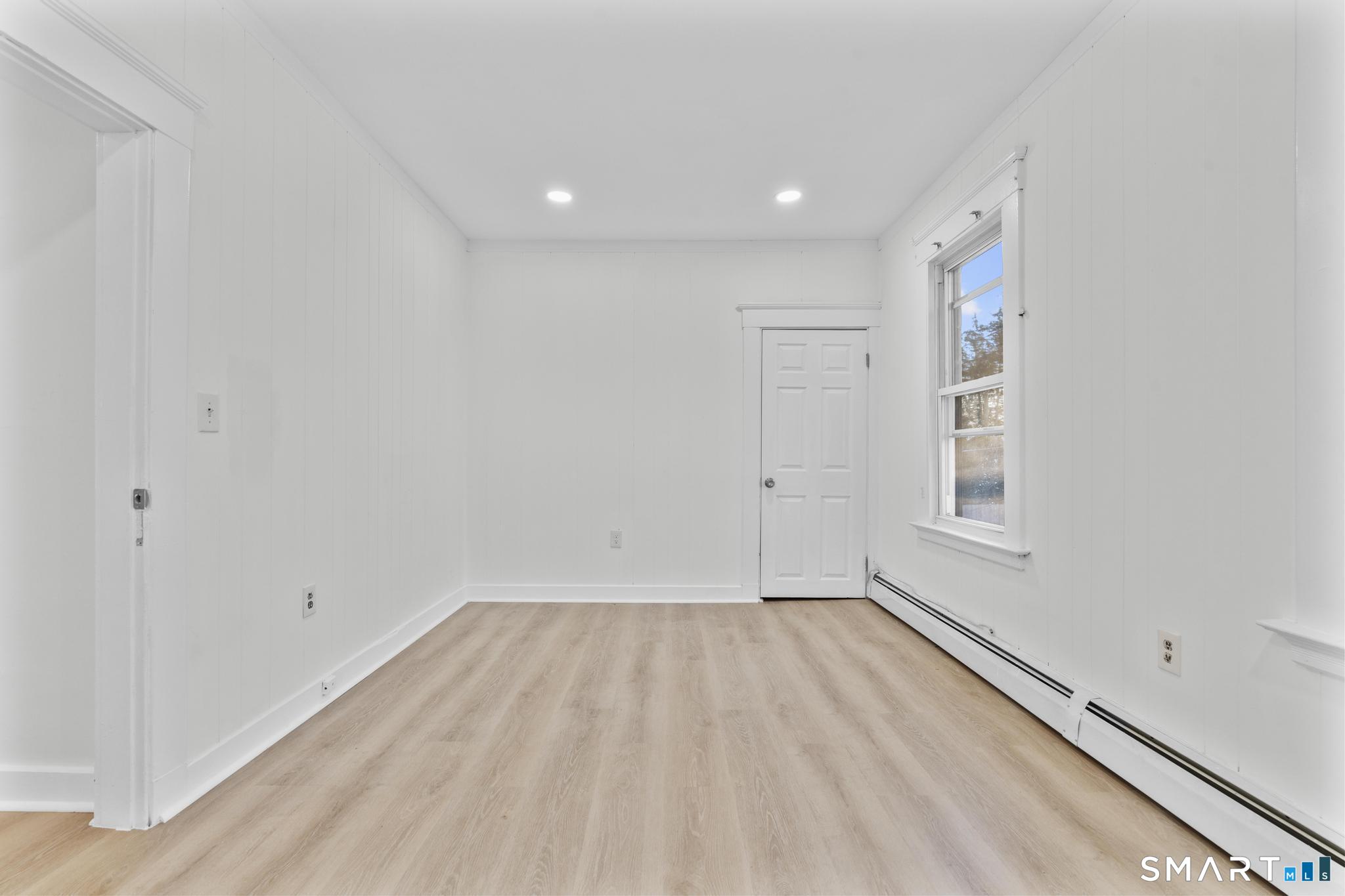 141 Augur Street Hamden, CT 06517 - Photo 2 of 25 a view of room with window and hardwood floor