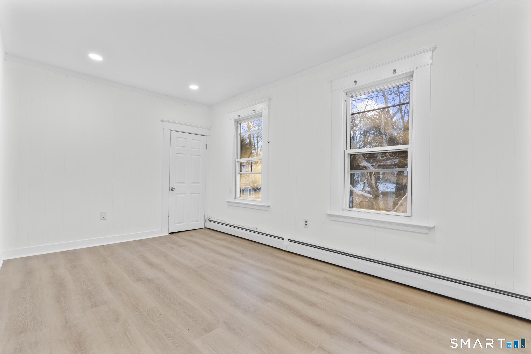 141 Augur Street Hamden, CT 06517 - Photo 5 of 25 an empty room with windows