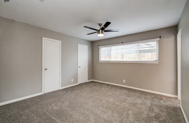 a view of an empty room with a window