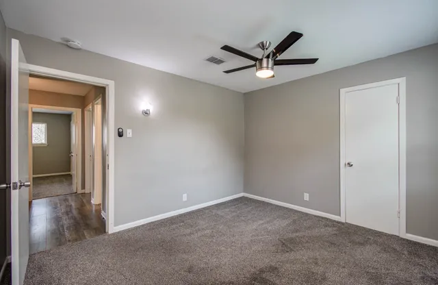 a view of a livingroom with a ceiling fan and a ceiling fan