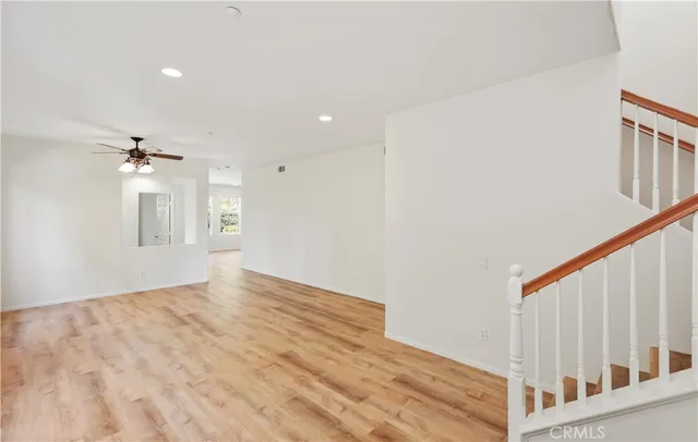 a view of an empty room with windows