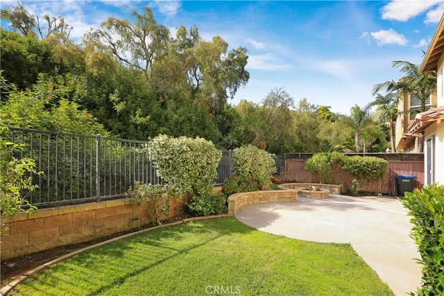 a view of a garden with a building in the background
