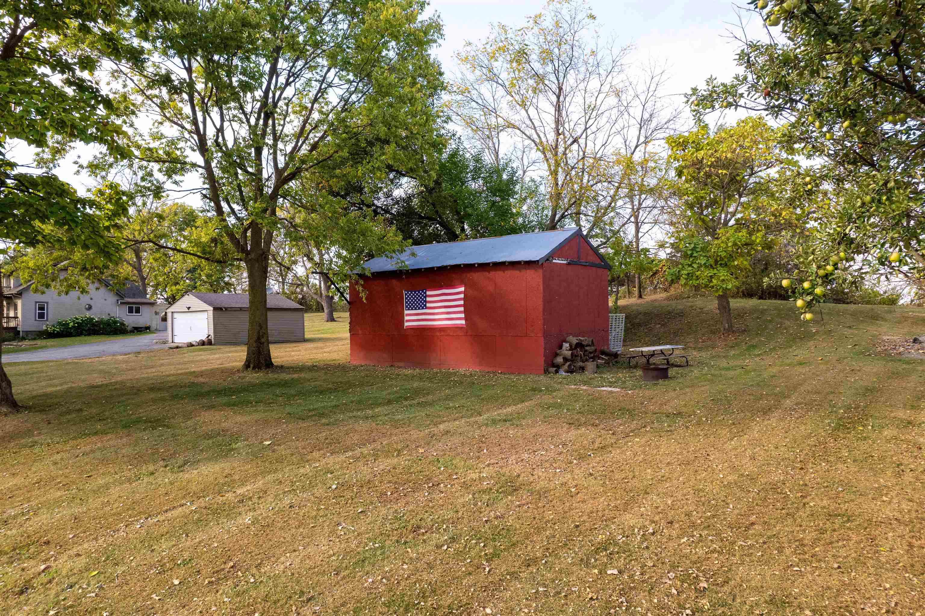 6155 South Perryville Road Cherry Valley, IL 61016 - Photo 20 of 92 a backyard of a house with lots of green space
