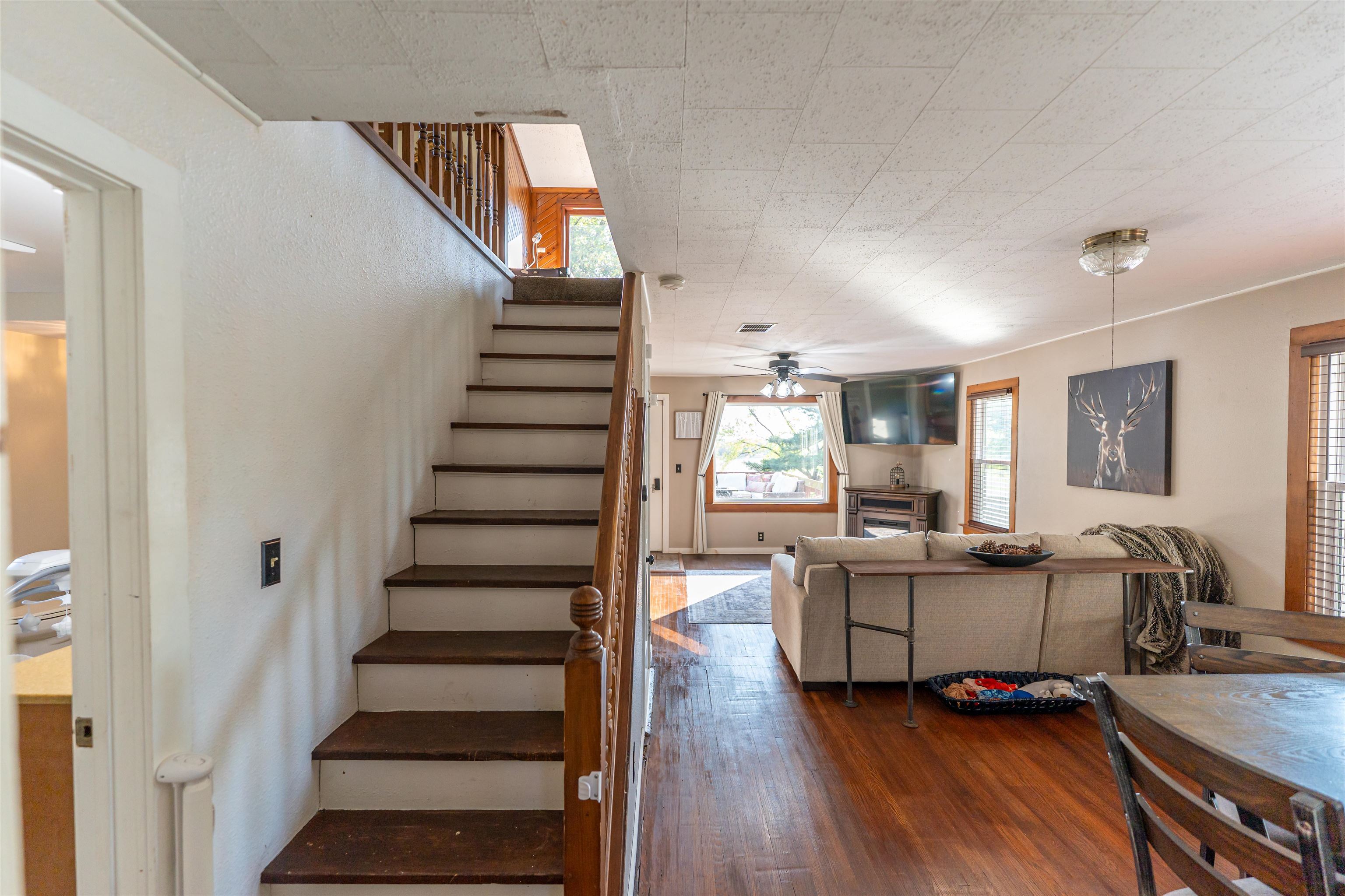 6155 South Perryville Road Cherry Valley, IL 61016 - Photo 35 of 92 a view of a livingroom with furniture and stairs