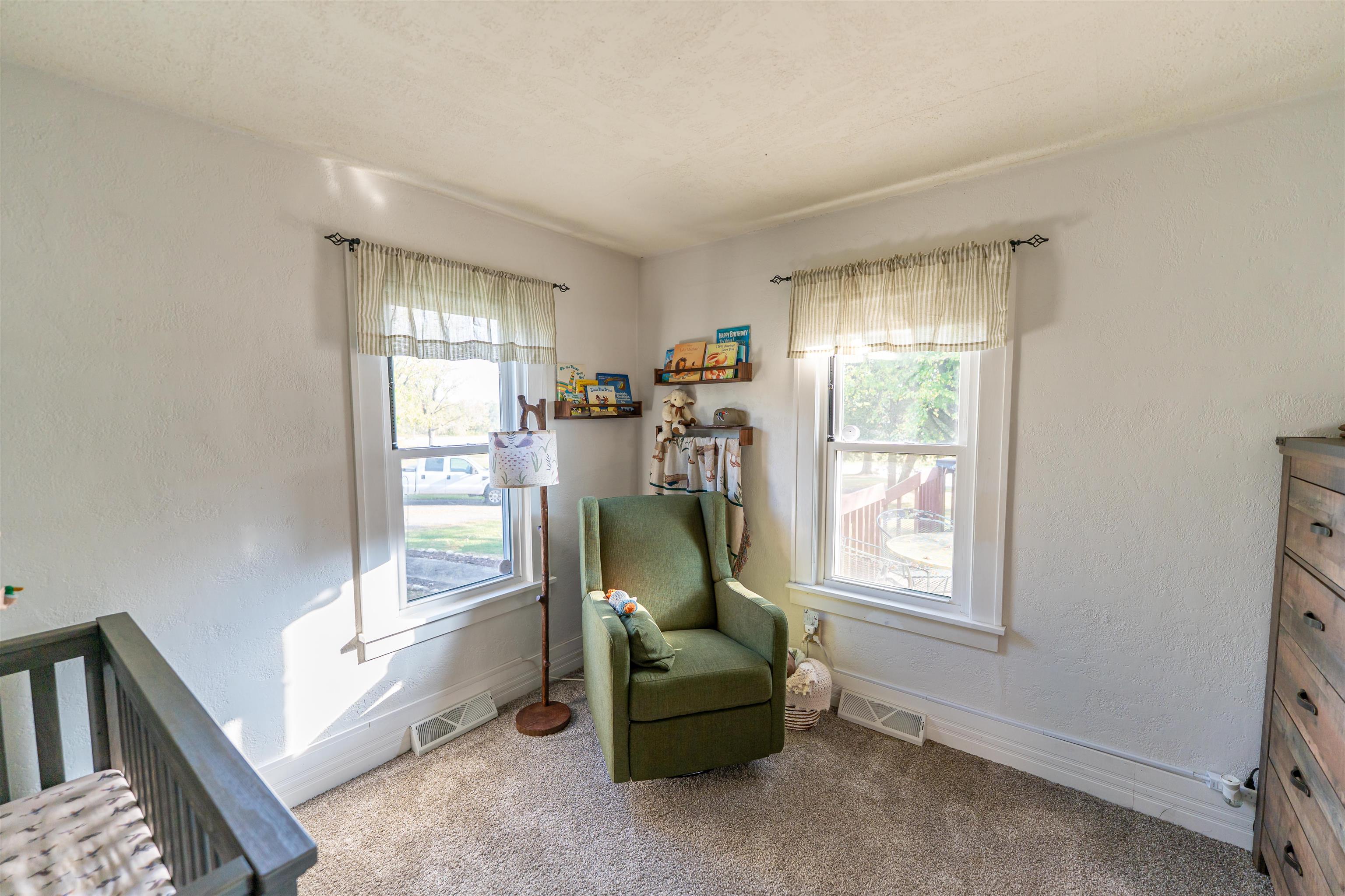 6155 South Perryville Road Cherry Valley, IL 61016 - Photo 44 of 92 a living room with furniture and a window