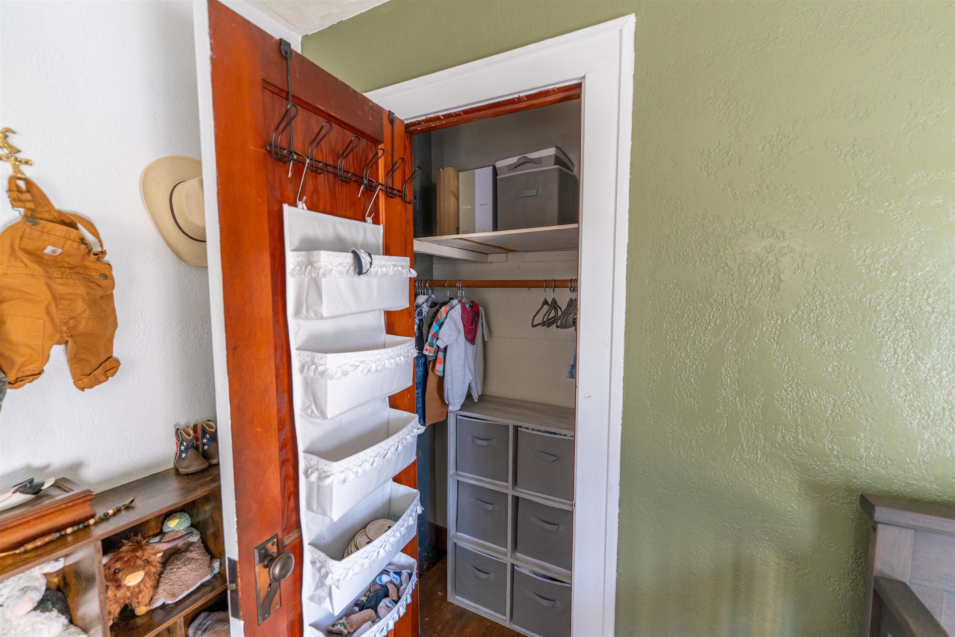 6155 South Perryville Road Cherry Valley, IL 61016 - Photo 45 of 92 a view of walk in closet with clothes and shoes