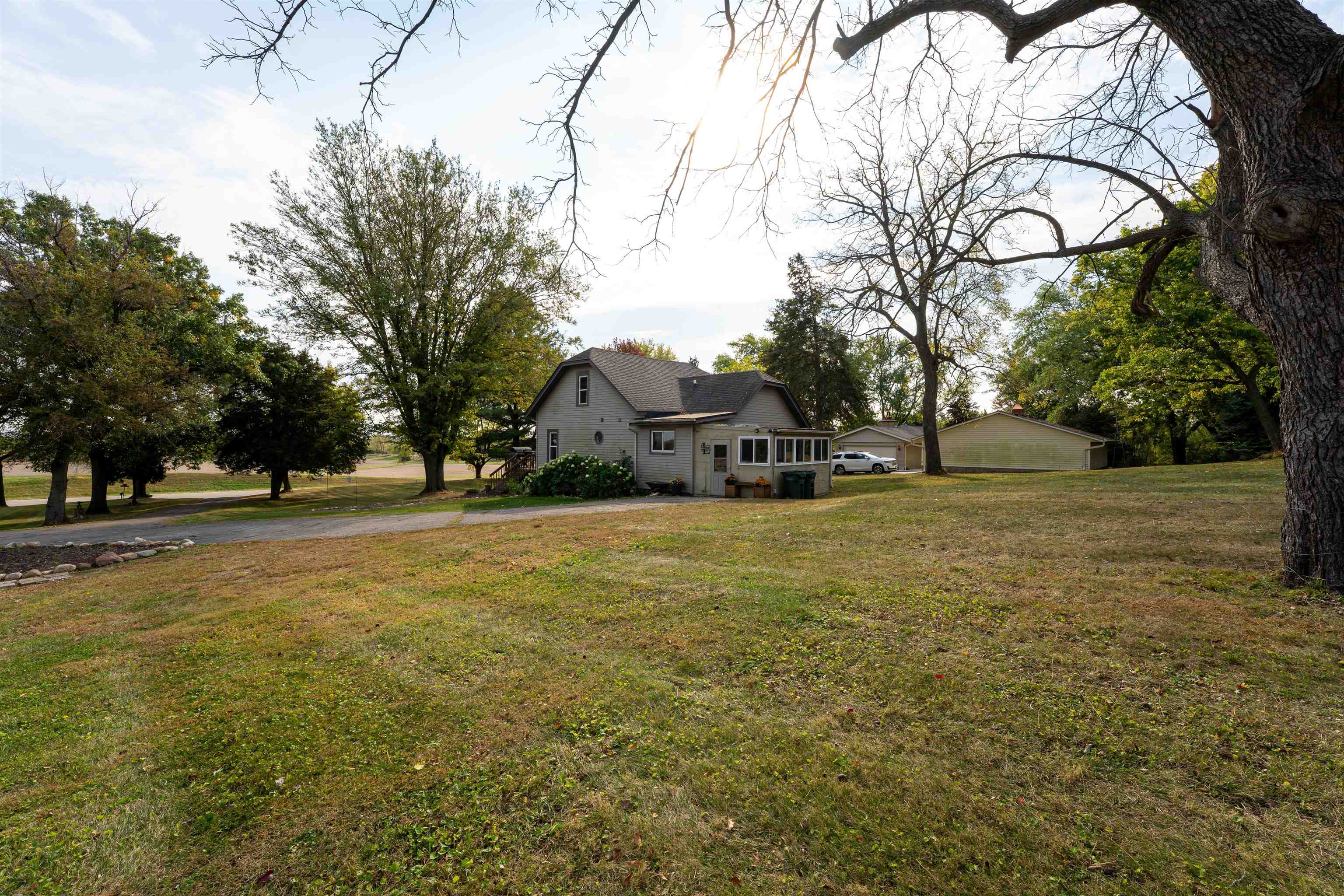 6155 South Perryville Road Cherry Valley, IL 61016 - Photo 85 of 92 a view of outdoor space with deck and trees
