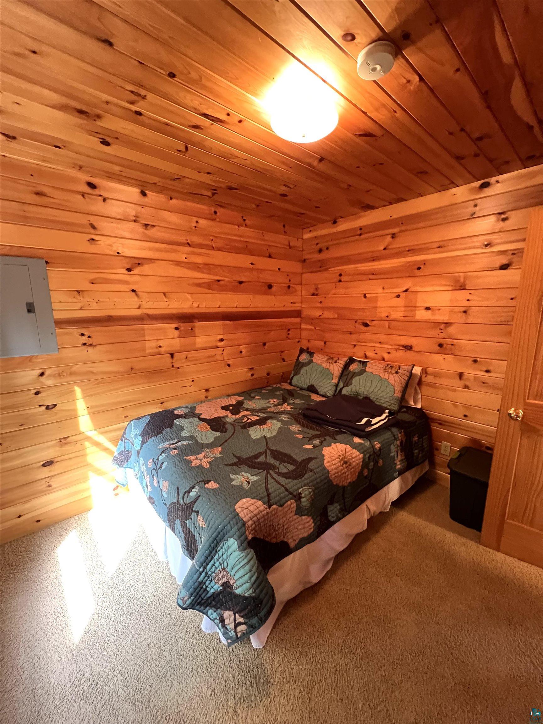 4366 Wood Ridge Drive Two Harbors, MN 55616 - Photo 10 of 21 Bedroom with wood walls and wood ceiling