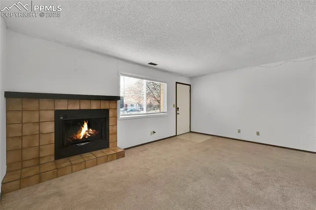 a view of an empty room with stairs