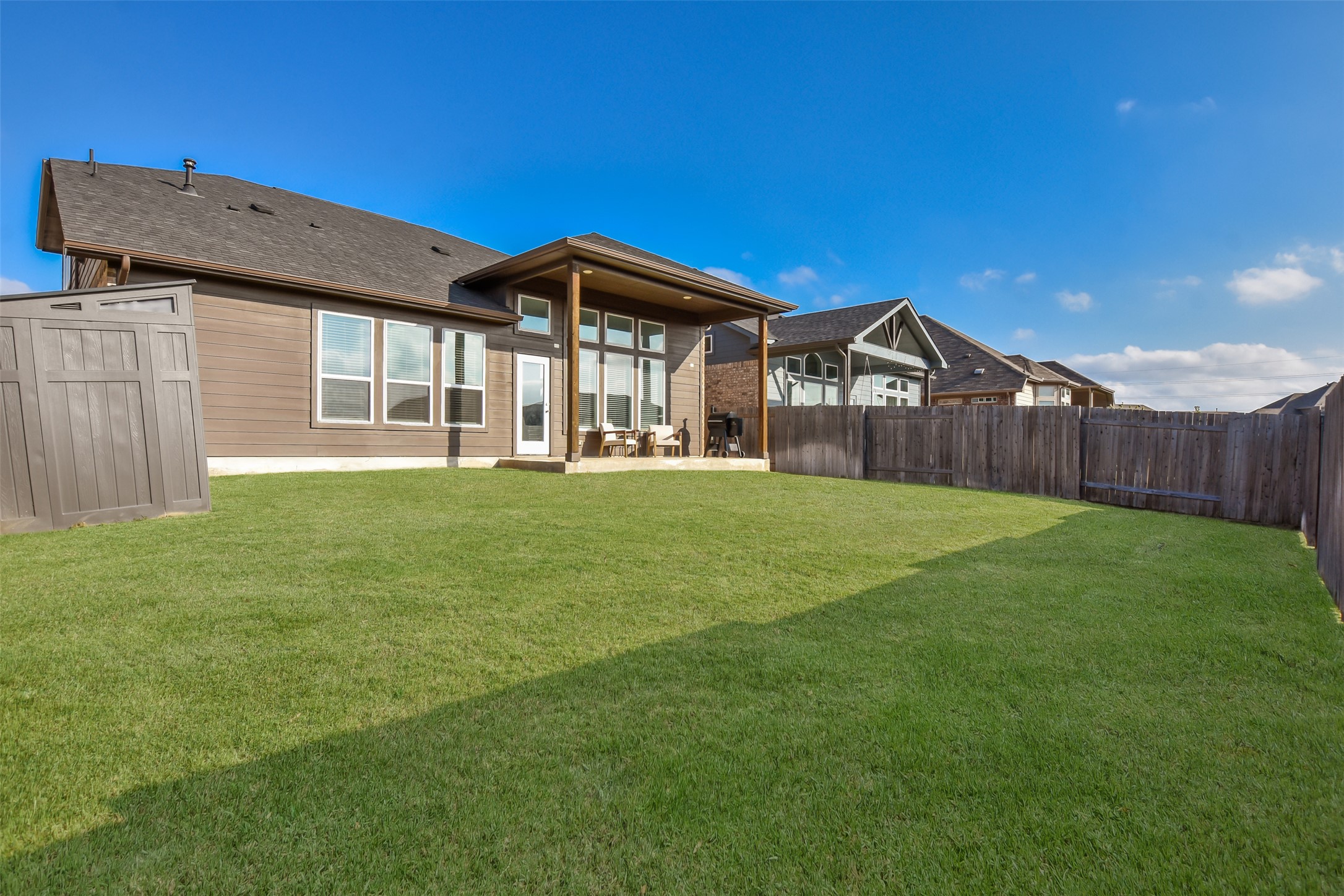 605 Oleander Loop Buda, TX 78610 - Photo 30 of 32 a front view of a house with a yard