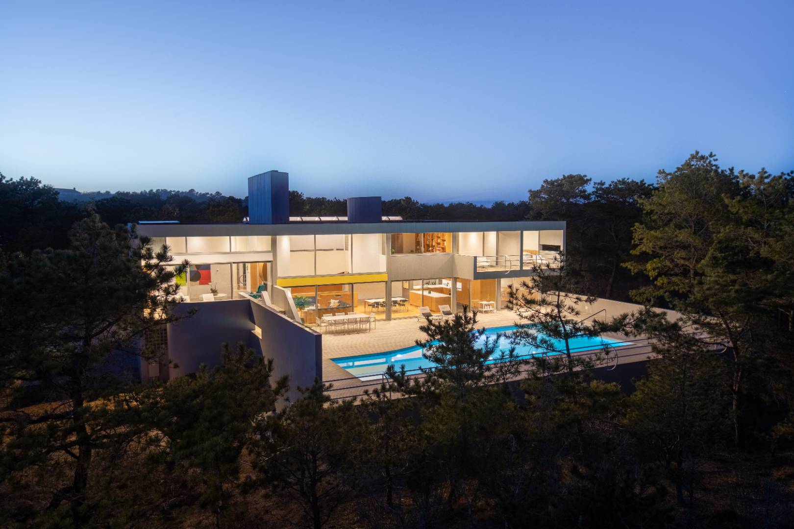 a view of a terrace with lawn chairs