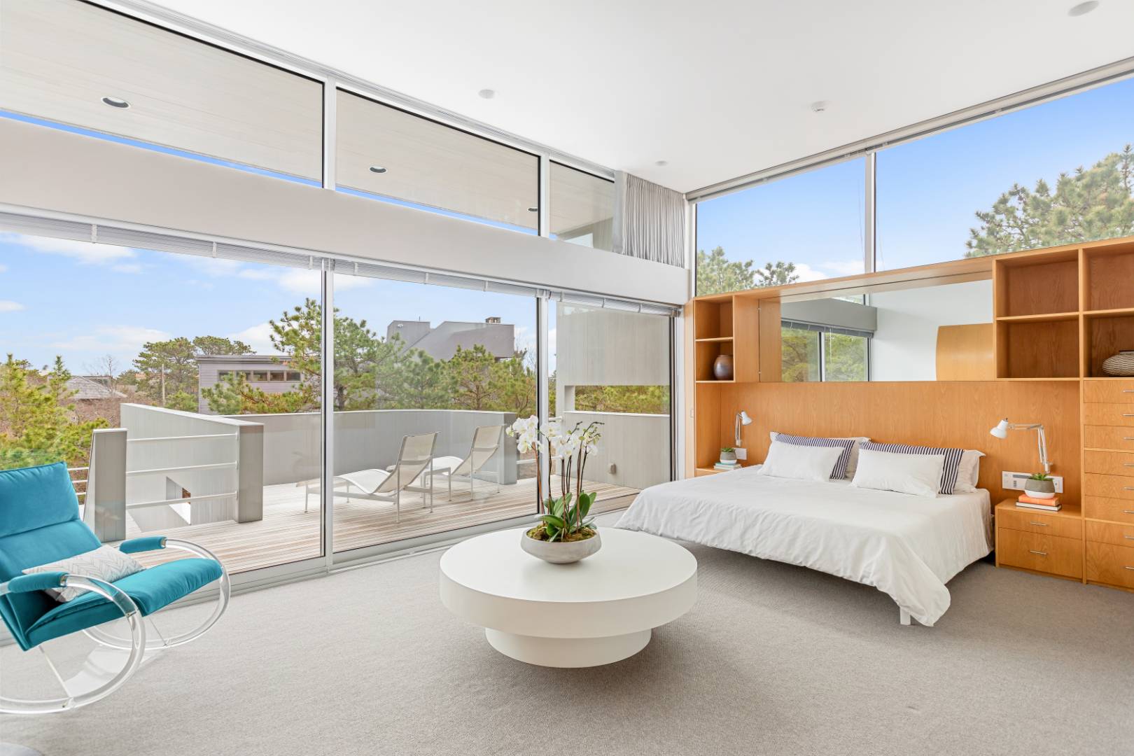 43 Gilberts Path Amagansett, NY 11930 - Photo 17 of 38 a living room with furniture and a floor to ceiling window