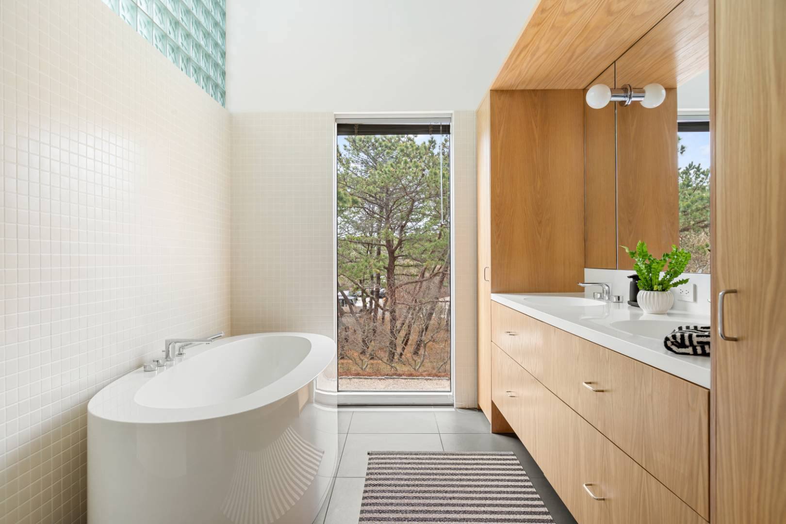 43 Gilberts Path Amagansett, NY 11930 - Photo 20 of 38 a bathroom with a sink a mirror and a shower