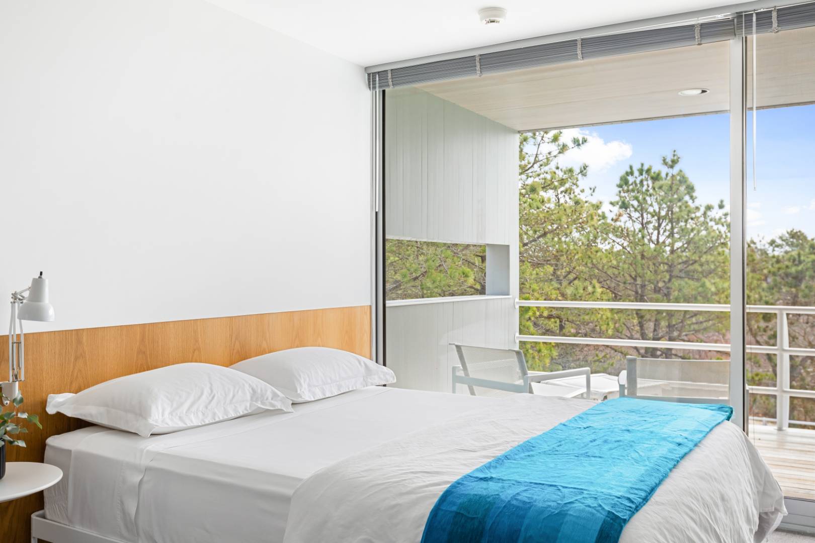 43 Gilberts Path Amagansett, NY 11930 - Photo 28 of 38 a bedroom with a bed and window