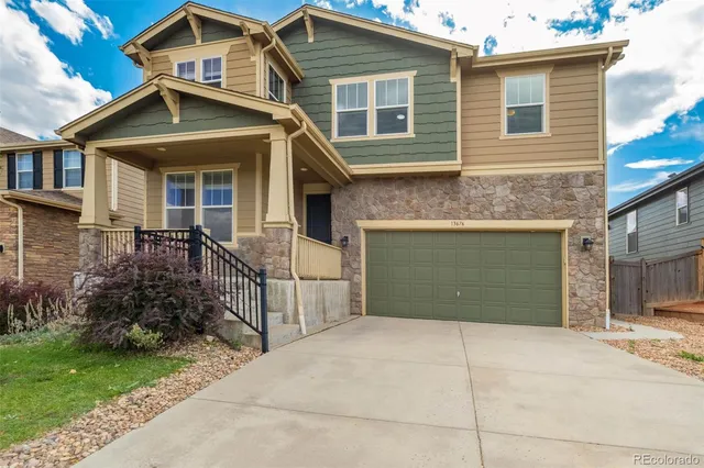 a front view of a house with garage