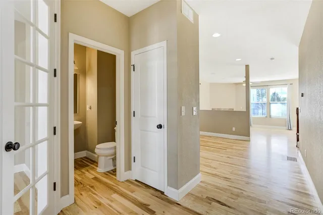 a bathroom with a sink and a glass door shower