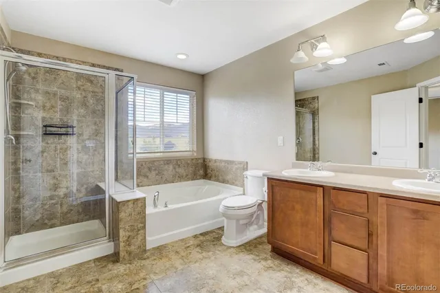 a bathroom with a bathtub toilet and sink