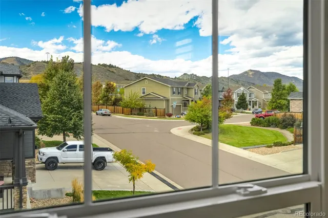 a view of a street with a building in the background