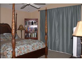 2513 Southern Melbourne, FL 32901 - Photo 10 of 12 a view of a bedroom with furniture and window