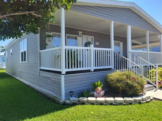 a view of a chair and table in the backyard