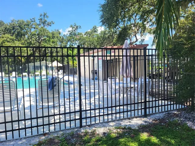 a view of a house with a yard and porch