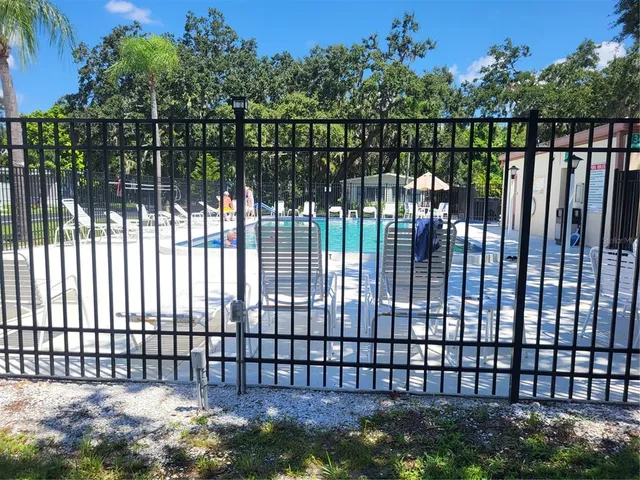 a view of a lake in the backyard of a house